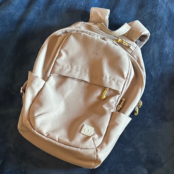 Doterra Handbags - Doterra Tan Backpack with Yellow Details